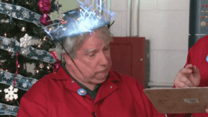 GIF of Chip and Bernie counting down to Christmas for I Spot Santa with a familiar Christmas tree reused in the background.