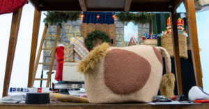 Filming family-friendly puppets and sets on a small budget production with creative reuse.